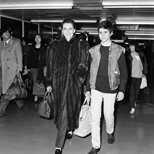 Actress Audrey Hepburn and her son Luca Dotti at an airport. April 1984