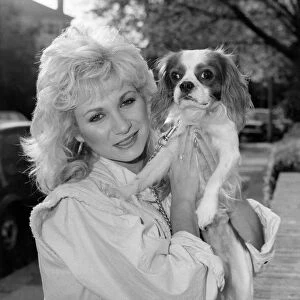 Actress Debbie Arnold, pictured at her flat with her King Charles spaniel