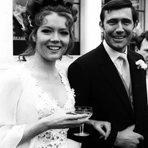 Actress Diana Rigg with George Lazenby getting married during the filming of "