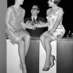 Actress Gillian French, bride to be, (left) and singer Valerie Masters are served a