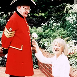 Actress Helen Mirren May 1994 at the Chelsea Flower show with a pensioner