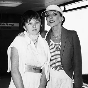 Actress Joan Collins with her daughter at Heathrow airport. August 1980
