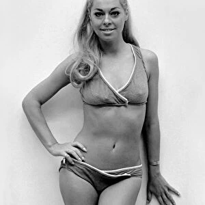 Actress Joan Crane was modelling a four-piece zip up swimsuit in stretch fabric by