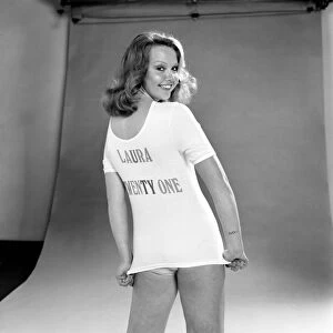 Actress Laura Collins poses wearing a t shirt and pair of knickers in the studio