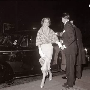 Actress Lauren Bacall is helped out of her car as she arrives at the royal film show The