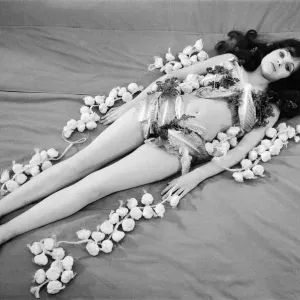 Print of Actress Maddy Smith on a bed with garlic and lettuce, Shepperton Studios, 2nd June 1972