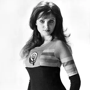 Actress Madeline Smith wears a sweater with an inset from the Allen Jones painting