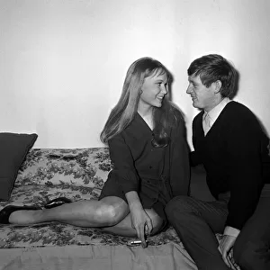 Actress Mia Farrow with singer John Leyton April 1964 sitting on sofa talking