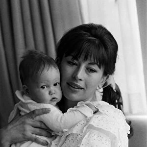 Actress Nanette Newman with her 4 month old daughter Emma at their home in Virginia Water