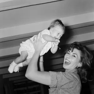 Nanette Newman with baby daughter at home in Virginia Water Print Nanette Newman with baby daughter at home in Virginia Water Print