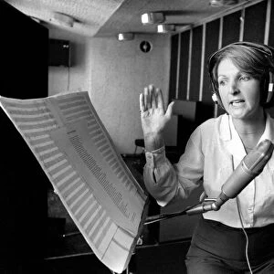 Actress Penelope Keith makes a record about a Dachsund dog. June 1980 80-03067-001
