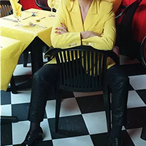 Actress Sherrie Hewson in her restaurant Booms in Richmond, sitting on a chair