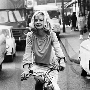 Actress Susannah York oct 1965 riding a bike on Kings road Chelsea