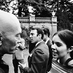 Actress Vivienne Ventura talks to Yul Brynner with Jimmy Greaves (centre