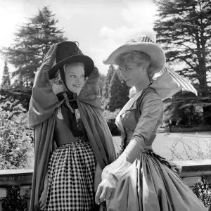 Actresses and models take part in a 18th century fashion parade at Pinewood Studios