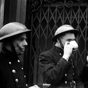 AFS Firemen having a tea break during a daylight raid on 31st January 1941