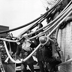 AFS men have to almost fight their way through a maze of pipes. 10th May 1941