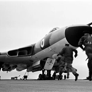 Air crew of 617 Squadron scramble their Avro Vulcan Bomber at RAF Scampton as part of a