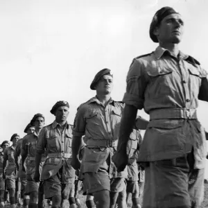Airborne units marching away after attending a church service. 1st Air Landing Bde Airborne units marching away after attending a church service. 1st Air Landing Bde