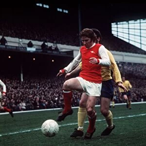 Alan Ball of Arsenal holds in control of the ball during a league match at Highbury