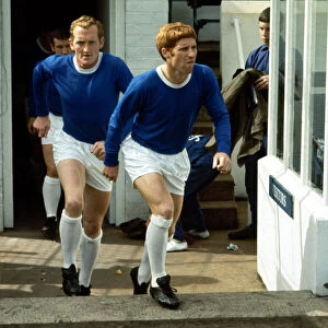 Alan Ball of Everton enters the pitch followed by teammate Sandy Brown before a match