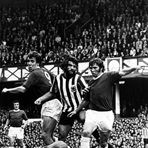 Alan Ball and Joe Royle of Everton sandwiched Trevor Huckey of Sheffield United in a