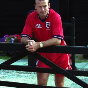 Alan Shearer August 1998 England Football Player standing leaning against fence