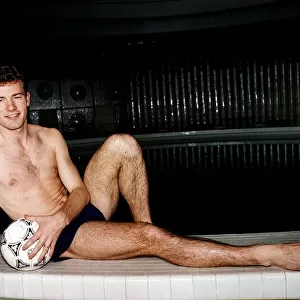 Alan Shearer Footballer relaxing by swimming pool with a football in his hand Dbase