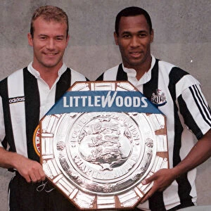 Alan Shearer and Les Ferdinand of Newcastle holding the charity Shield before Sundays