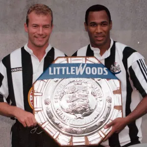 Alan Shearer and Les Ferdinand of Newcastle holding the charity Shield before Sundays