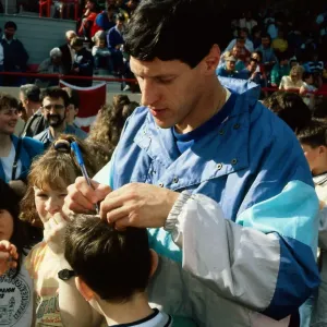 Alan Wells signing autograph on childs head November 1988 Alan Wells signing autograph on childs head November 1988