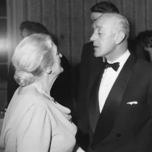 Alec Guinness talking to Sybil Thorndike at the Evening Standard Theatre Awards party