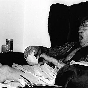 Alex Higgins World Snooker Champion 1982 has a yawn at home after reading all