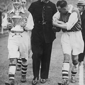 Alex James Arsenal Captain leaving the ground with the FA Cup after defeating Sheffield