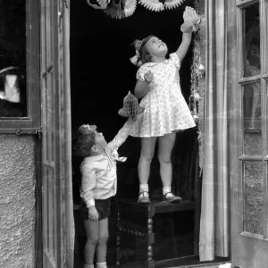 Alfieri. 1273. Child Studies-Hanging up Christmas decorations. Betty Graves and Keith