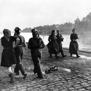 All the girls (Curers) are idle, still few herring come in