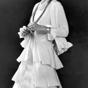 All that jazz... Cream sleeveless dress de chine has triple flared skirt All that jazz... Cream sleeveless dress de chine has triple flared skirt
