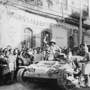 Allied forces enter Damascus. Vehicles of the Free French pause in Damascus