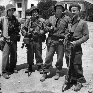 Allied soldiers of four different nations searching through the town of Littoria in Italy Allied soldiers of four different nations searching through the town of Littoria in Italy