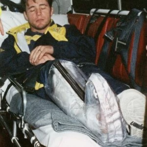 Ally McCoist with broken leg arriving at Edinburgh Airport 1994