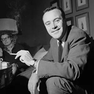 American actor Jack Lemmon smoking a cigarette during a press reception at the Mayfair