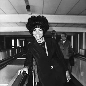 American actress and singer Eartha Kitt arriving at Heathrow Airport in London to have