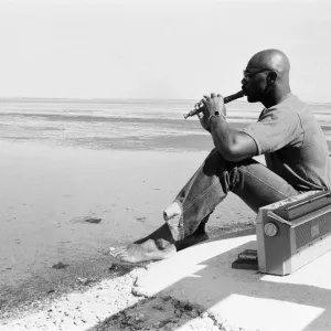 American boxer Marvin Hagler relaxes with a flute ahead of his title challenge against American boxer Marvin Hagler relaxes with a flute ahead of his title challenge against