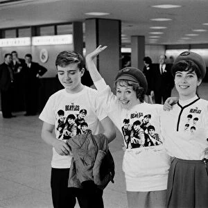 American fans wearing Beatles t shirts await the arrival of their heroes at New York