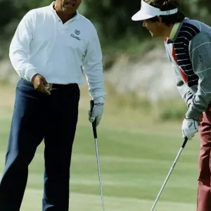 American golfer Lee Trevino talking to another player who is about to take putt American golfer Lee Trevino talking to another player who is about to take putt