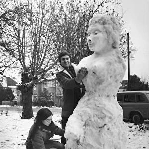 American graduate student Ken Donney and his wife Jill seen with giant snow woman they