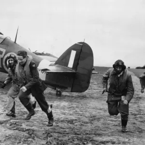 American pilots of No 71 Eagle Squadron rush to their Hurricanes American pilots of No 71 Eagle Squadron rush to their Hurricanes
