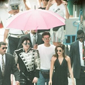 American pop singer Michael jackson with his new bride Lisa-Marie Presley walking