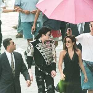 American pop singer Michael jackson with his new bride Lisa-Marie Presley walking
