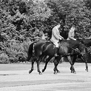 American President Ronald Reagan astride the horse Centennial riding with Queen Elizabeth